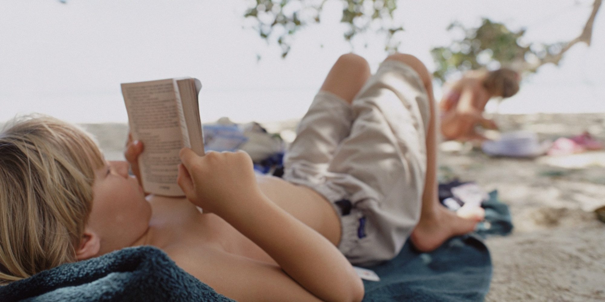 o-CHILD-READING-BEACH-facebook